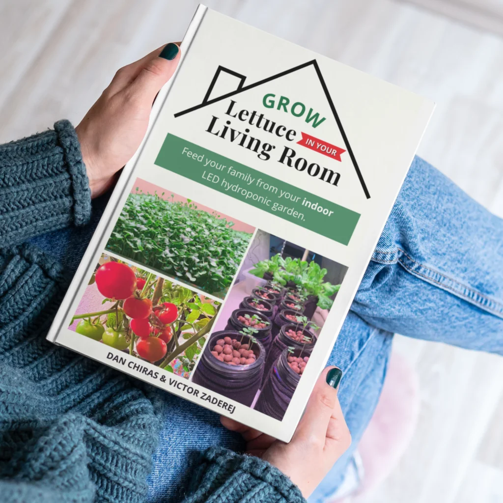 woman holding book called grow lettuce in your living room