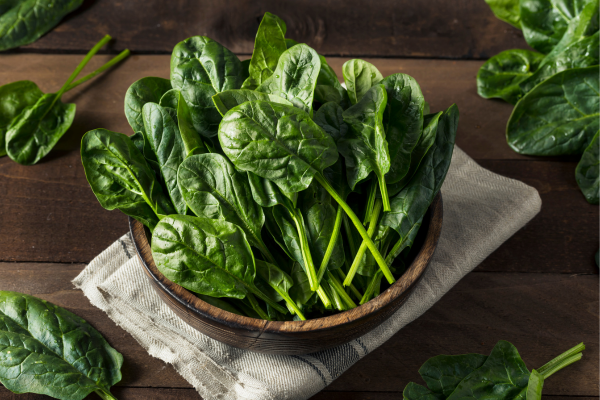 Spinach in bowl on table